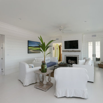 White Family Room - Wood Walls - Family Space - White Floor - Blue Front Door