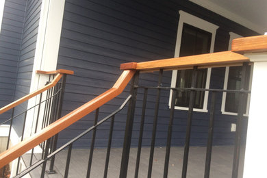 Example of a large trendy blue three-story house exterior design in Boston