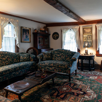 Historic Living Room with Exposed Beams and Antique Furnishings – South Hamilton