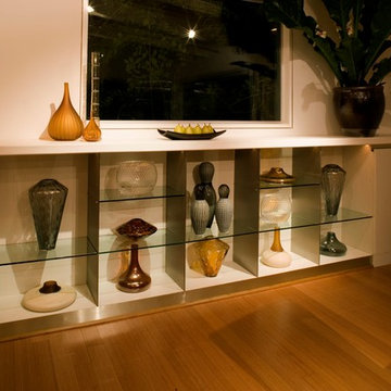 cabinets with art display shelves by MGS architecture