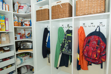 Mudroom - mid-sized traditional ceramic tile mudroom idea in Philadelphia with beige walls