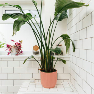 Pink & green bathroom with mix of tiles & patterns
