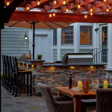 Make a Statement with a Versatile Outdoor Kitchen and Double Fire Feature