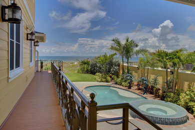 Water fountain deck - mid-sized traditional backyard water fountain deck idea in Tampa with no cover