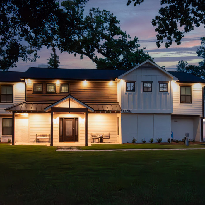 This was a full exterior rebuild due to 1 tree falling on the house and a second tree falling on the garage.  The exterior features 4 different types of siding including prefinished stained siding by