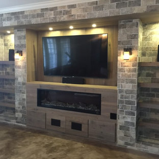 Elegant concrete floor and beige floor home theater photo in Atlanta with beige walls