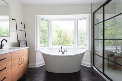 Mid-sized minimalist master white tile double-sink and black floor bathroom photo in Ottawa with medium tone wood cabinets, quartz countertops, white countertops, a freestanding vanity and white walls