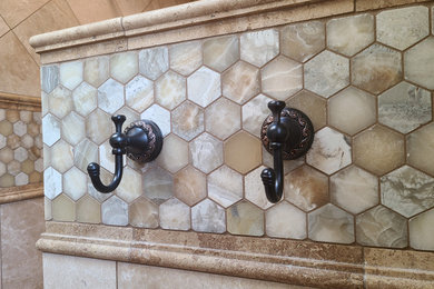 Example of a tuscan 3/4 beige tile and travertine tile mosaic tile floor and multicolored floor bathroom design in Seattle with beige walls