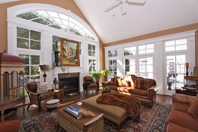 Inspiration for a transitional formal and enclosed dark wood floor living room remodel in DC Metro with beige walls, a standard fireplace and a plaster fireplace