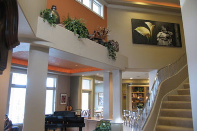Foyer - large traditional foyer idea in Seattle with beige walls