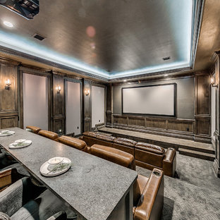 Inspiration for a large rustic enclosed carpeted and gray floor home theater remodel in Oklahoma City with gray walls and a projector screen