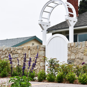 Coastal Cottage with Natural Stone Wall and Rustic Brick Pathways