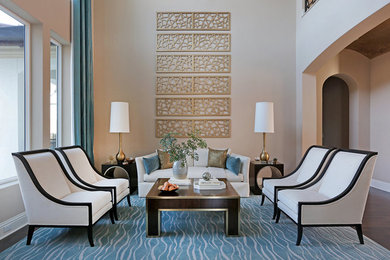 Inspiration for a mid-sized transitional formal and open concept brown floor and dark wood floor living room remodel in Jacksonville with beige walls, no fireplace and no tv