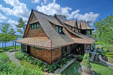 Huge rustic brown two-story wood exterior home idea in Minneapolis