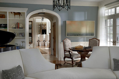 Inspiration for a large transitional formal and enclosed medium tone wood floor living room remodel in Chicago with blue walls, a standard fireplace, a wood fireplace surround and no tv
