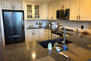 Example of an arts and crafts kitchen design in Charlotte