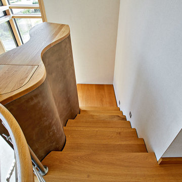 Faltwerktreppe aus Eiche in geschwungener Sonderausführung