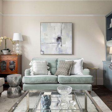 Calm & serene living room with a mix of chrome & brass metal accents