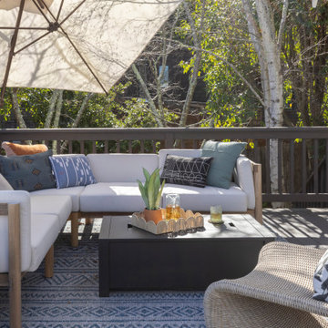 Bright Deck Featuring Convertible Fire Table, Woven Chair, and Layered Textiles