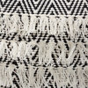 Baxton Studio Alain Black and Ivory Handwoven Wool Tassel Pouf Ottoman