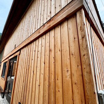 Aging cedar (wood) siding with brand-new cedar plank