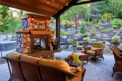 Mid-sized arts and crafts backyard patio photo in Seattle with a fire pit