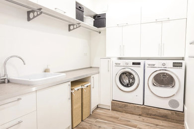 Inspiration for a laundry room remodel in Other