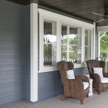 Wow! Front porch renovation with wicker chairs & wood porch ceiling!