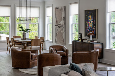 Living room - transitional medium tone wood floor and brown floor living room idea in Atlanta with white walls