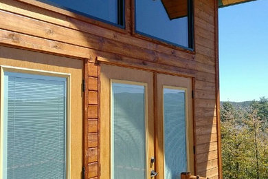 Inspiration for a mid-sized rustic backyard deck remodel in Phoenix with a roof extension