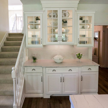White Kitchen with Gray Quartz Countertops, Farmhouse Sink and Hardwood Floors
