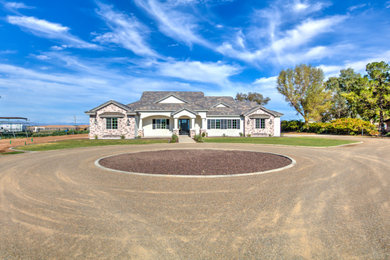 Large white brick exterior home photo in Phoenix