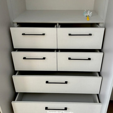 Custom-made closet drawers and organization.