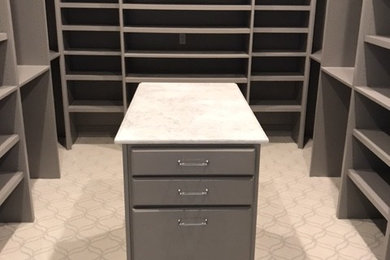 Bathroom - large contemporary master gray tile and marble tile marble floor and white floor bathroom idea in Denver with raised-panel cabinets, white cabinets, a two-piece toilet, gray walls, an undermount sink, quartzite countertops, a hinged shower door and white countertops