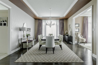 Photo of a mid-sized transitional open plan dining in Toronto with multi-coloured walls and dark hardwood floors.