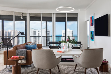 Inspiration for a contemporary beige floor living room remodel with white walls and a wall-mounted tv