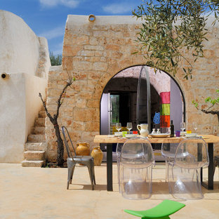 他の地域の中サイズのサンタフェスタイルのおしゃれな裏庭のテラス (日よけなし) の写真