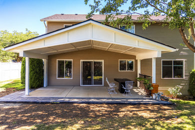 Mid-sized minimalist concrete patio photo in Seattle with a gazebo