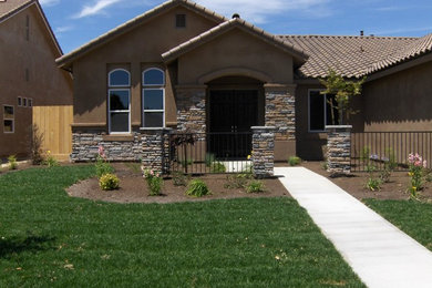 Inspiration for a brown one-story exterior home remodel in Other