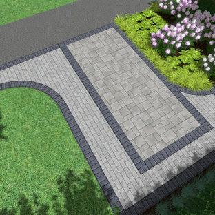 Design ideas for a mid-sized modern front yard full sun driveway for summer in Toronto with with path and concrete pavers.