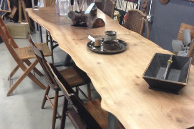 Wood slab dining table with steel legs