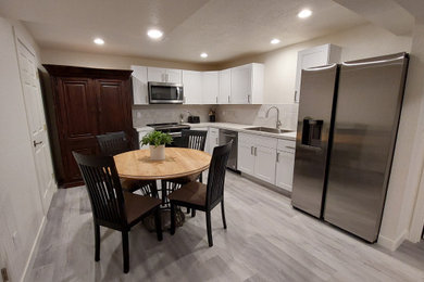 Basement - traditional gray floor basement idea in Other