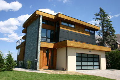 Mid-sized minimalist multicolored two-story mixed siding exterior home photo in New York