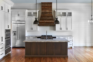 Large beach style medium tone wood floor kitchen photo in Charleston with a drop-in sink and stainless steel appliances