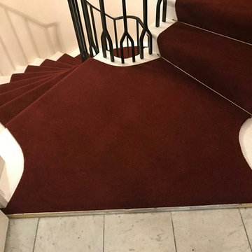 Red runner on a spiral staircase