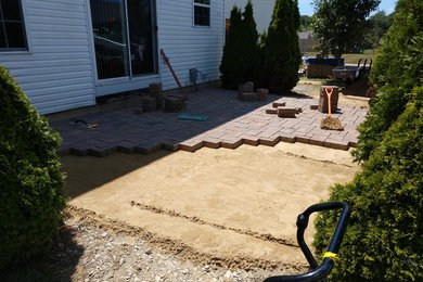 Backyard concrete paver patio photo in Cleveland