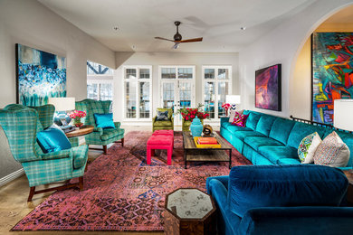 Living room - large eclectic open concept medium tone wood floor and brown floor living room idea in Other with gray walls, no fireplace and no tv