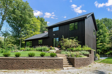 Example of a minimalist black three-story house exterior design in Chicago