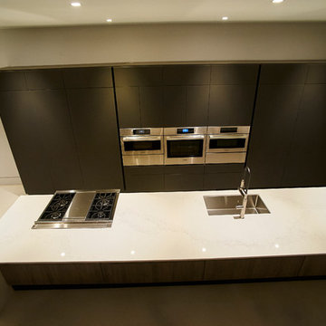 Integrated Kitchen Island with Hidden Appliances and Seamless Cabinetry