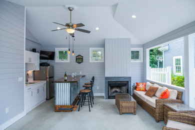 Example of a beach style sunroom design in Providence